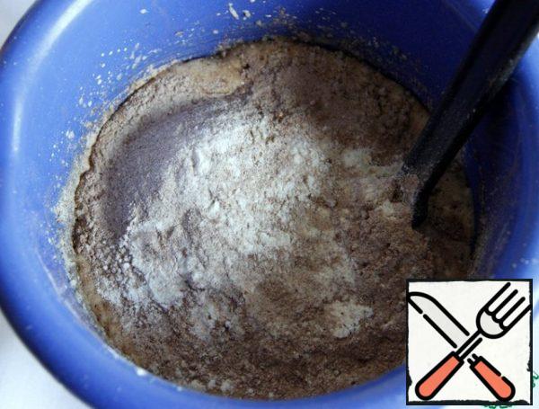 Flour, baking soda, baking powder, cocoa sift in a bowl, mix until smooth and stir in the dough.