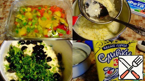 When the first layer hardens, you need to prepare two second ones.
To do this, take the feta cheese, rub it through a sieve.
Add to it coarsely chopped olives and finely chopped parsley.