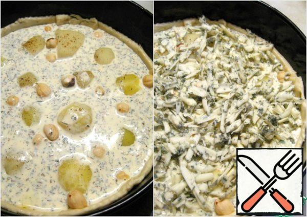Pour over the potatoes. Sprinkle the pie with grated cheese.
Bake in a preheated 180* oven for about 35 minutes.
