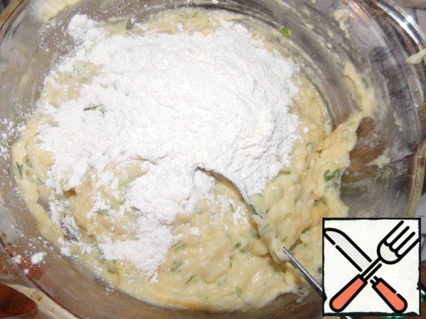 Then add flour to our dough and mix well.

