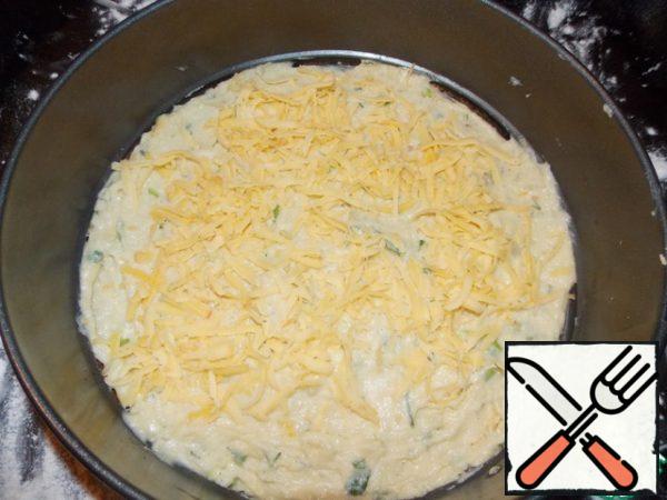 1 layer spread half of the potato dough and grate half of the cheese on top.