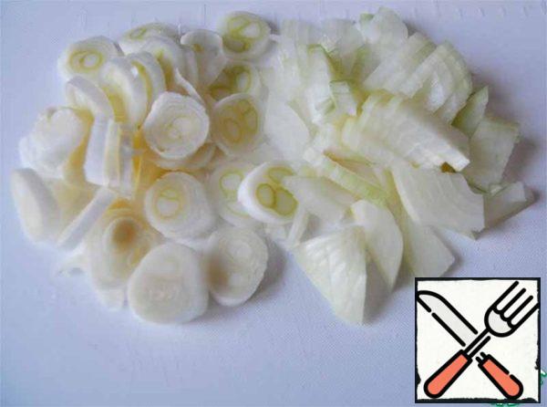 Onions cut into small cubes, and leeks rings.