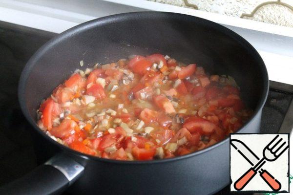 Add the tomatoes and simmer for 2 minutes.
