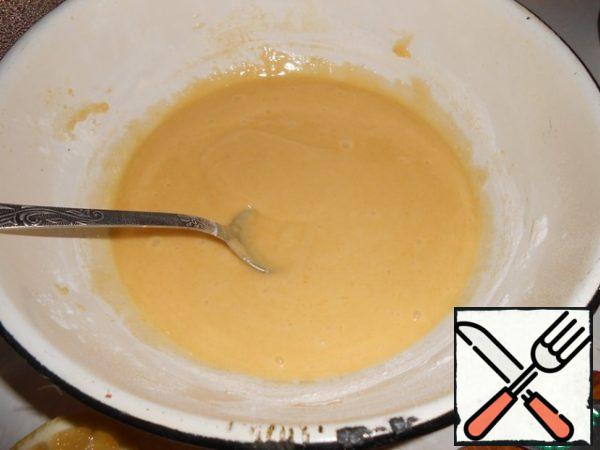 Melt margarine in a water bath, add sugar, eggs and mix. Add the sifted flour and baking powder.