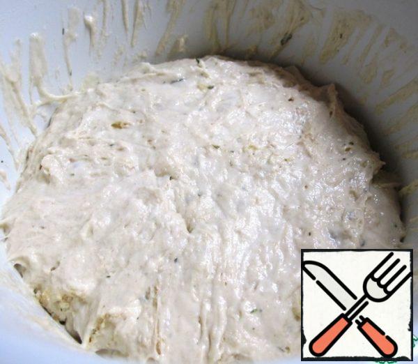 Without removing the film, put the dough in the refrigerator overnight, where it will settle and acquire the desired consistency.
