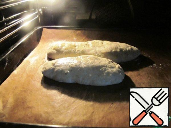 Cover the top with egg or milk, put in the oven for 20-30 minutes at 50 * C for proofing, then bake until ready at 180*C.
If the bread products are small, put a bowl of hot water down the oven so that they are baked in the presence of steam.