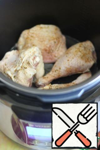 In the bowl of a slow cooker, heat the oil and put the chicken