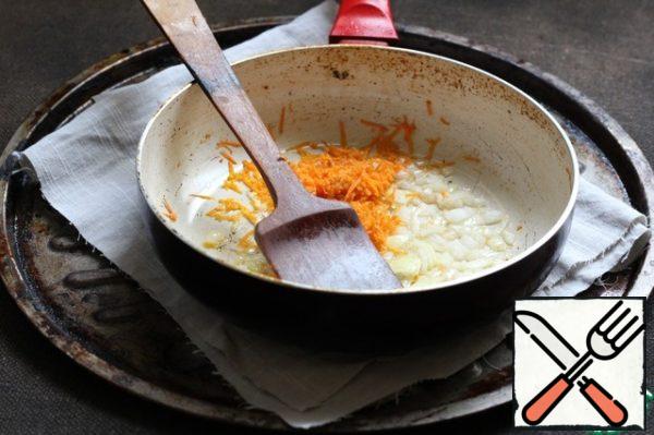 Grate the carrots and finely chop the onions.
In a frying pan heat the vegetable oil and put the onion. Fry until soft. Then add the carrots, stir and fry a little more.