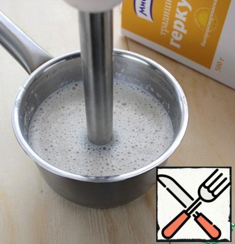 Soaked in milk oat flakes grind in a blender.