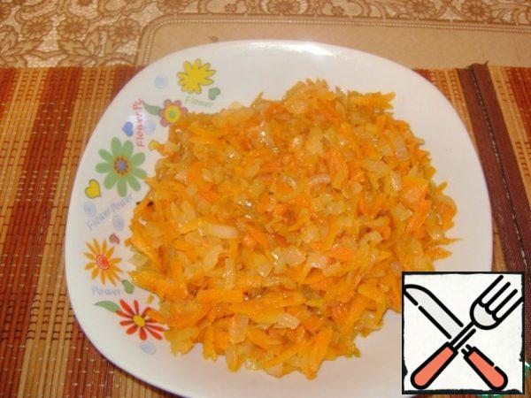 Carrots and onions fry in a small amount of vegetable oil until tender.