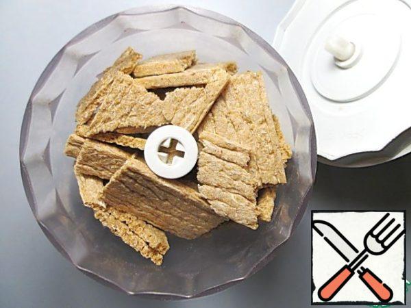 Grind the bread to crumbs. Instead of loaves, you can use salted crackers.
