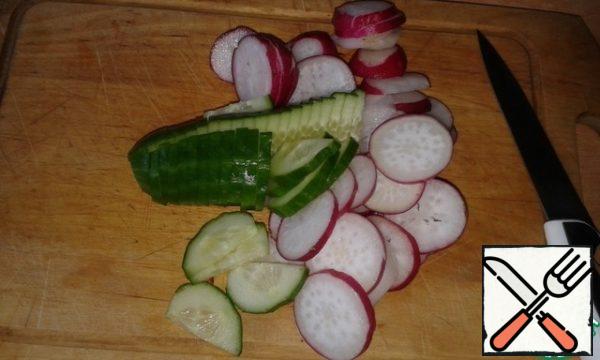 Radish and cucumbers cut into circles (or semicircles, if the vegetables are large).
