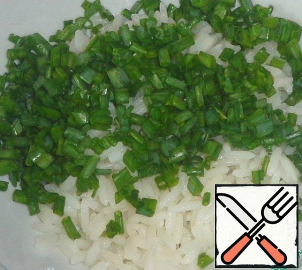 Add chopped green onions to the rice.