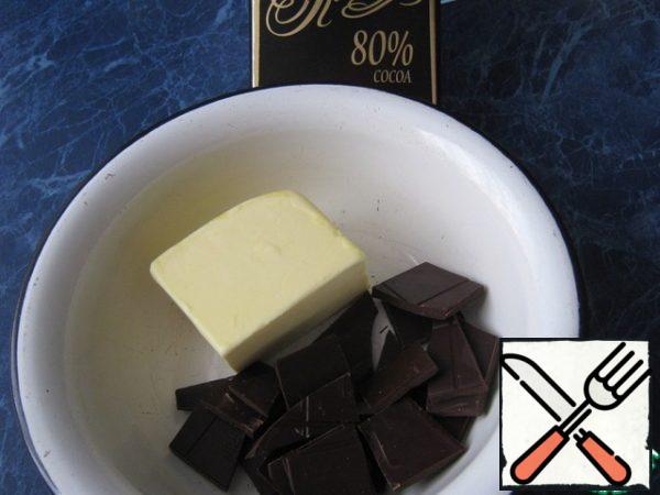 Break the chocolate, add butter.