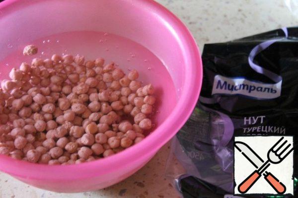 Soak the chickpeas in water, and then boil them according to the instructions on the package.
