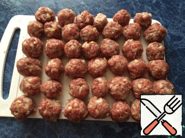Roll the meatballs.