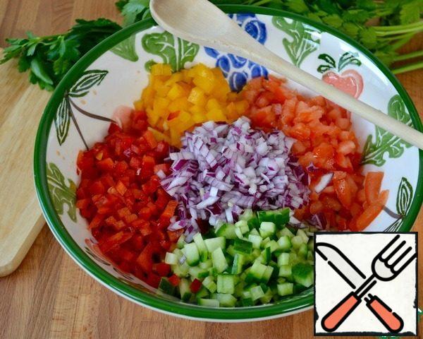 In a bowl put all the other diced vegetables-peppers, cucumber, onion, and tomatoes.