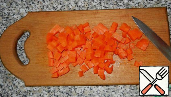 To prepare the vegetables. Boil carrots, cool and dice.