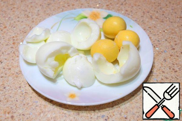 Boil eggs. Separate the whites from the yolks.