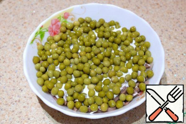 Lay out the canned peas.
