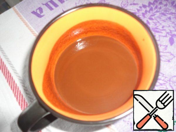 Pour cocoa powder, coffee and vanilla with boiling water, mix well and leave to cool.
