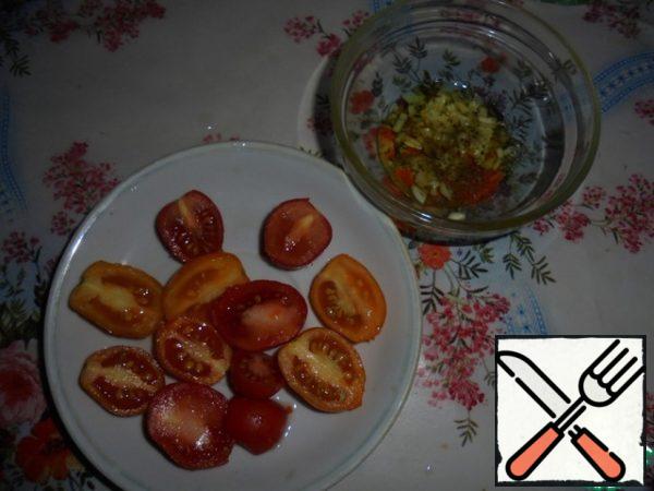 Cut cherry tomatoes into halves.
Garlic finely chop.
For dressing to olive oil add chopped garlic, salt and pepper to taste. Stir.