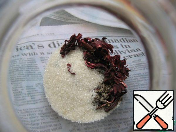 Pour hibiscus and lavender in a kettle or jug, add sugar.