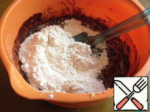 Add the flour sifted with salt and baking powder. Stir with a spatula.