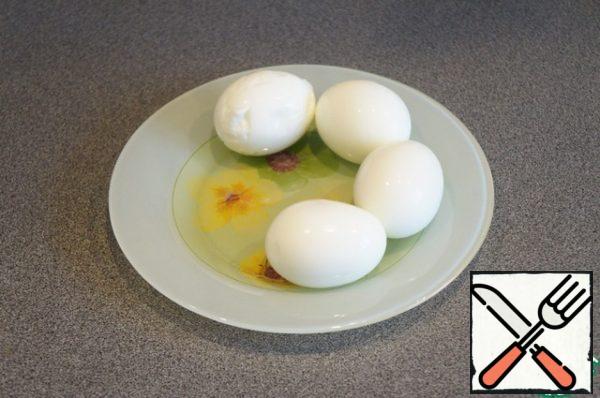 Chop the eggs, putting two yolks.