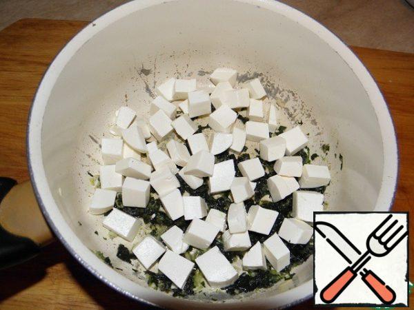 Cheese (or feta) cut into cubes and add to the garlic mixture.
