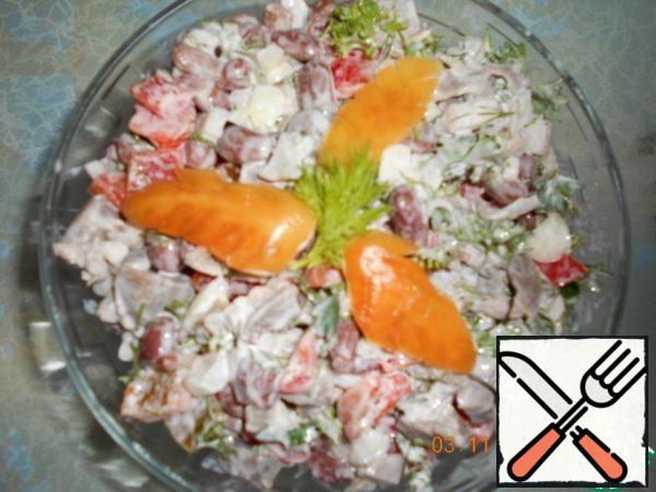 Season the salad with mayonnaise.