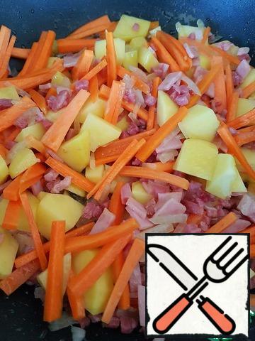 Carrots cut into strips or small cubes, potatoes into cubes. Add to the pan, stir and fry all together for about a minute.