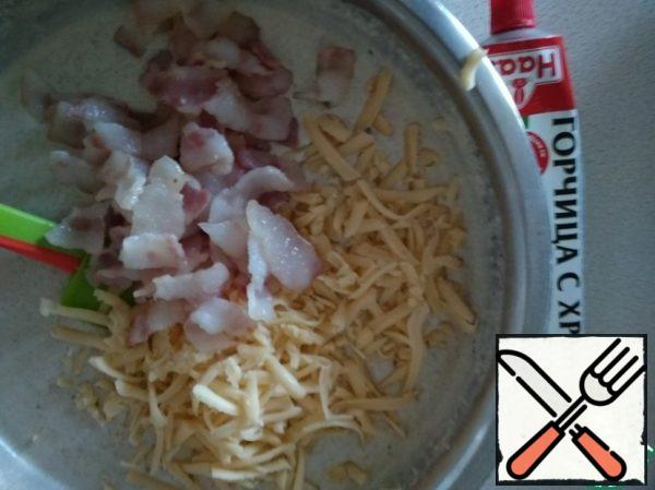 Cut bacon and Fry.
Grate the cheese.
Cut the greens.
Mix everything.
