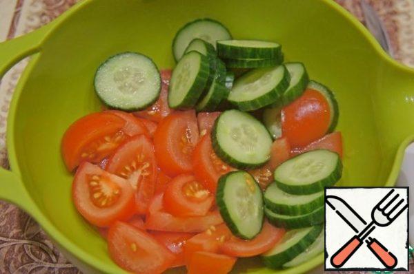 Cucumber and tomatoes cut into not too thin slices.

