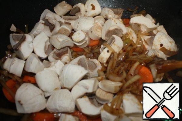 Then add the mushrooms and fry for 5 minutes.
