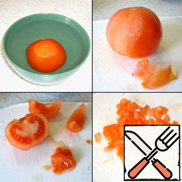 Tomato parboiled (so it is easy to clean the skin), cleaned, cut into pieces without seeds.