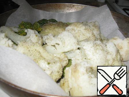 Boil cauliflower and broccoli in salted water and put in a form with baking paper.