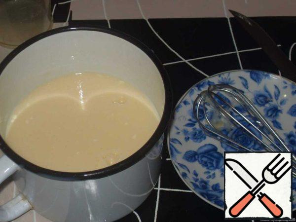 Add cottage cheese, stir. Then dilute the mixture with milk.