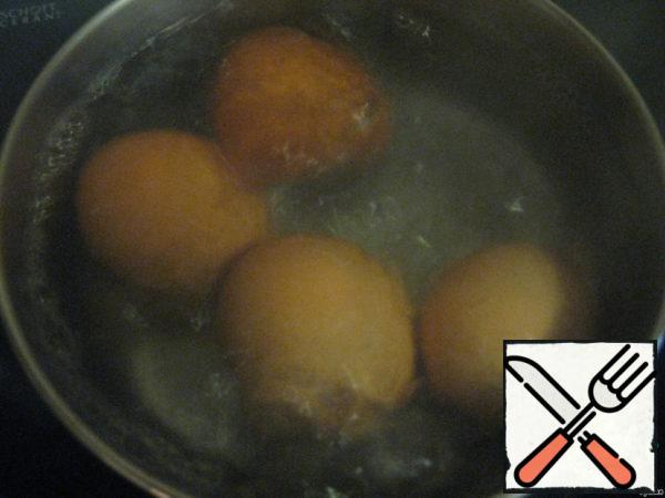 Boil the eggs until tender, cool, and peel.