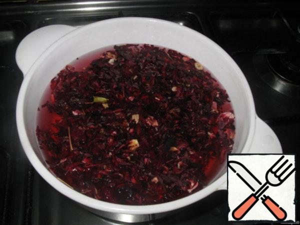 Put the hibiscus in a bowl with cold water, bring to a boil, add sugar, remove from heat, insist and cool.
To filter.  