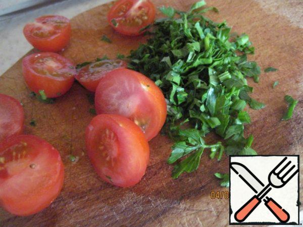 Cut fresh herbs and cherry in half. The original tomatoes were not, but they are much tastier!