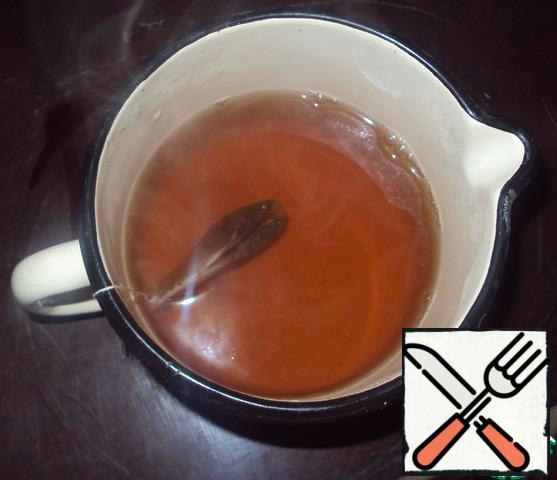 Brew strong black tea with lemon.
