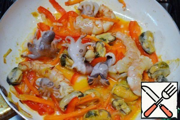 Add the seafood and fry for about 5-7 minutes.
