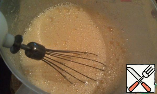 Beat eggs with sugar on medium speed.
