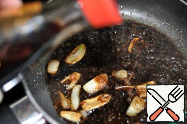 Pour the soy sauce into the pan.