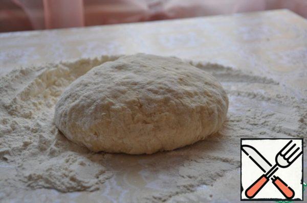 From flour, eggs, water and salt knead the dough. It should be of the consistency as dumplings. Wrap in cling film and put away for 10 minutes in the freezer.
