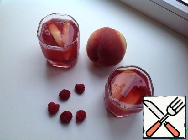 Pour into glasses and go to drink cooling green tea with peaches and raspberries on the balcony - summer after all!!!