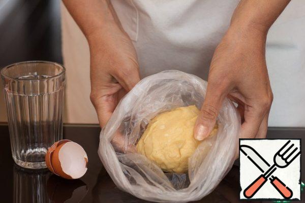 Grind the flour with a knife or in a blender with cooled butter until crumbs. Add lemon juice, egg and salt, mix, roll into a ball with your hands, knead the dough and wrap it in a film, put it in the refrigerator
