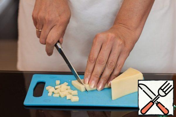 Cut Adyghe cheese into small cubes.