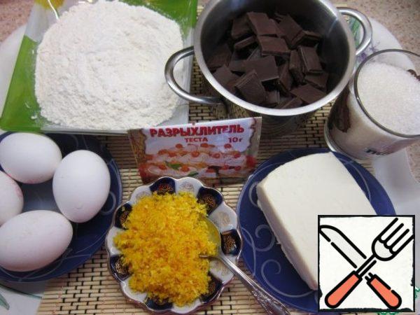 These are all ingredients.
Use a fine grater to remove the zest from the orange.
Mix flour with baking powder.
